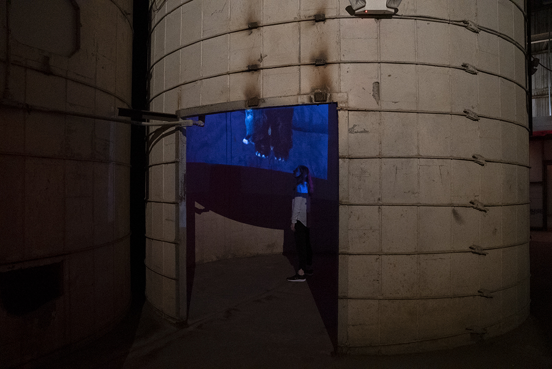 Screen on column in lobby showing water flowing over rocks